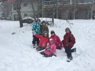 Students playing in snow.