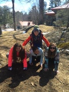 Students making a human pyramid.
