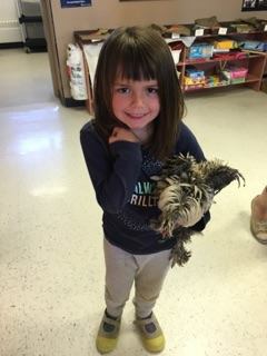 Student holding a chicken.